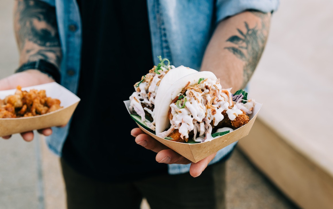 a person holding a chicken bao